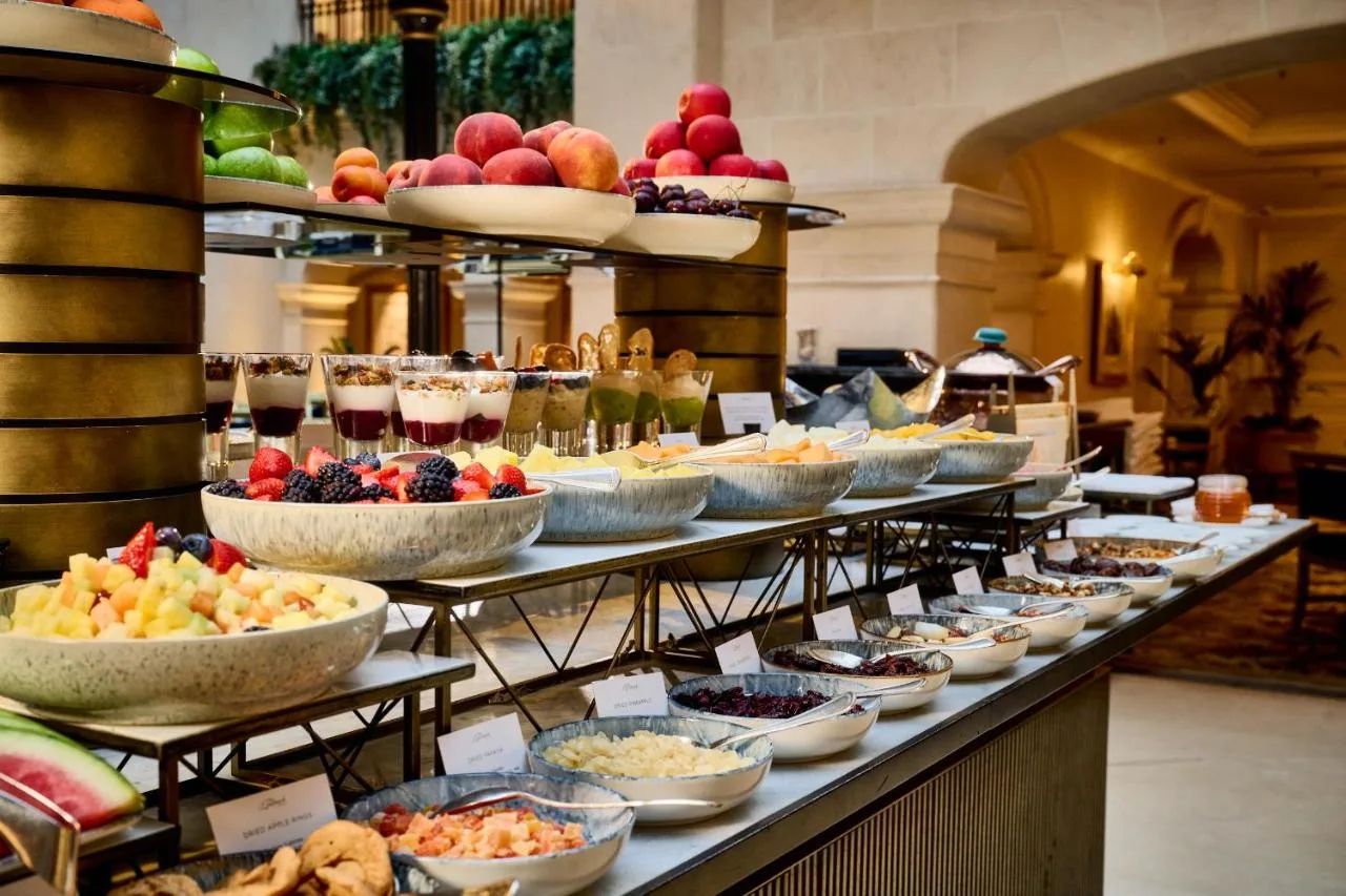 Buffet line with bowls of food at The Landmark London